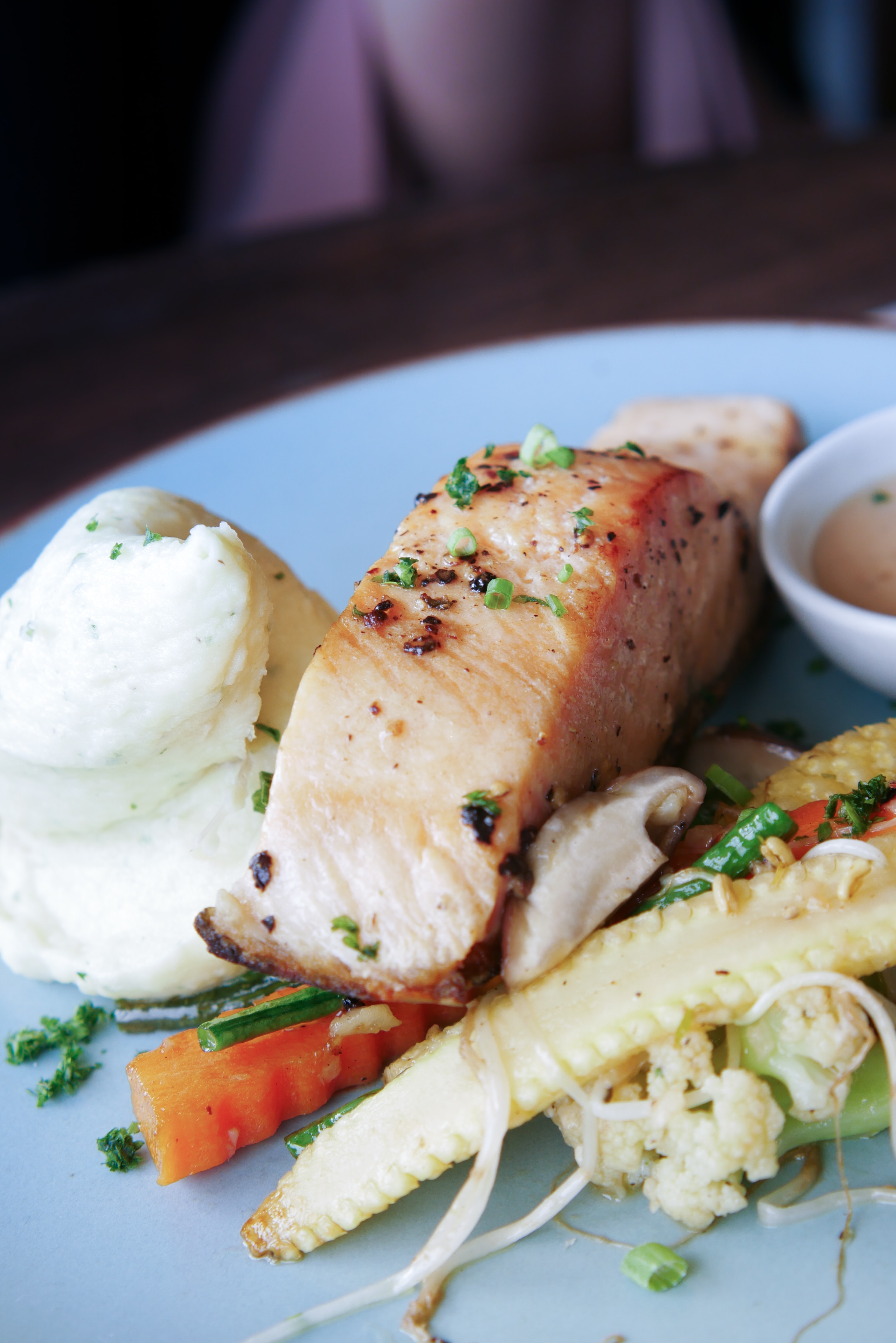 Plated dinner with cooked salmon and fresh veegtables